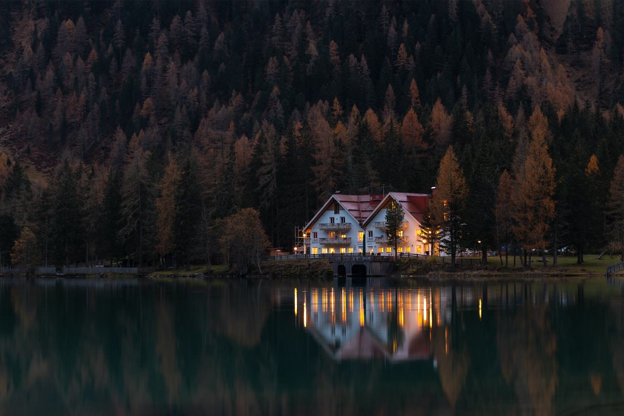 A house on the water during the evening.